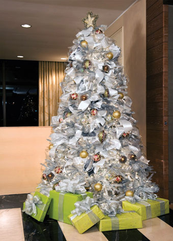 Saum sprayed this sparkling, glitzy tree for the Georgetown Jingle silver and dusted it with glitter.