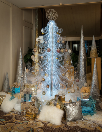 A lucite tree, carved to hold ornaments, was designed by Julie Shanklin and Marielle Shortell of Syzygy Events.